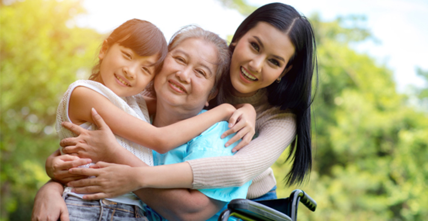 grandma, mother, and daughter all smile