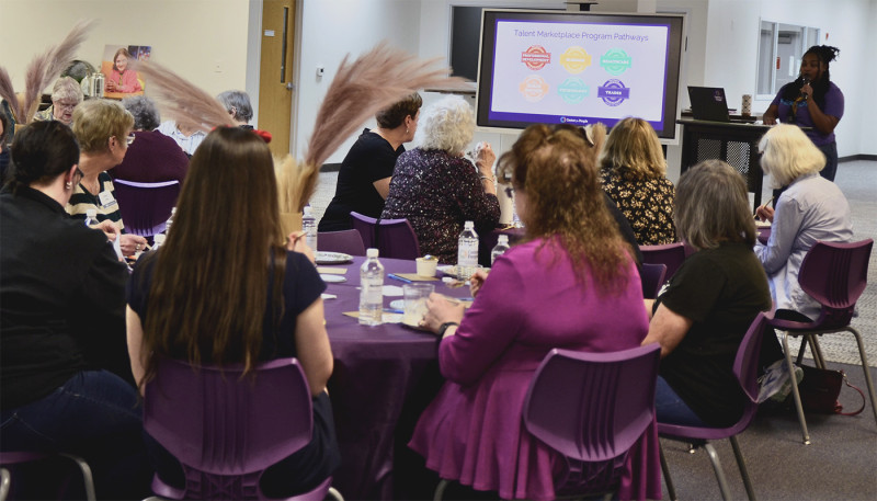 aliya at the center for people in need shares more information with the journey participants 